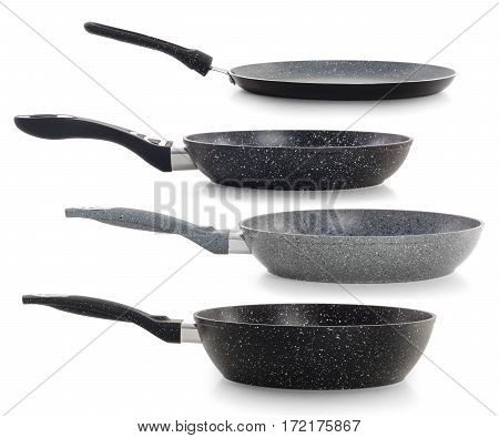 Set of four black frying pans isolated on white background