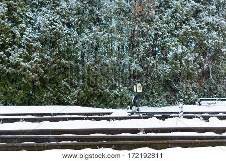Rail switch (Hand rail shooter) in the snow. Railway.