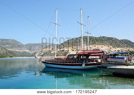 ANTALYA TURKEY - APRIL 24: The yacht in harbor on Turkish resort on April 24 2014 in Antalya Turkey. More then 36 mln tourists have visited Turkey in year 2014.