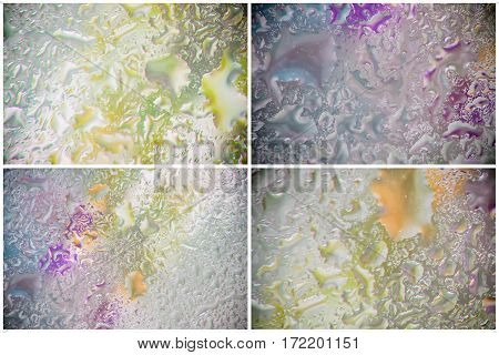 Flowers of primroses behind the wet window with realistic rain drops. Abstract background in modern halftones with raindrops, blurred style. Delicate tints for modern pattern, wallpaper, banner design