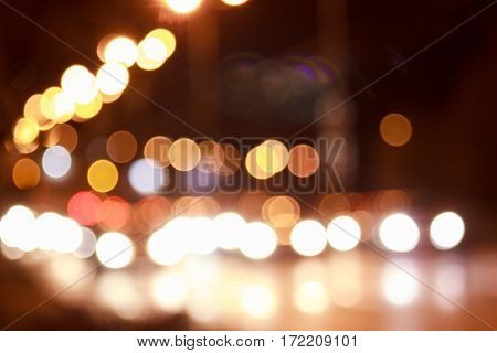 Bright lights of streets in night city with blur effect.
