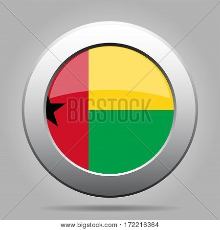 National flag of Guinea-Bissau. Shiny metal gray round button with shadow.