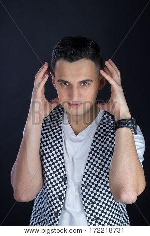 Portrait Of May Holding His Hands Like Earphones