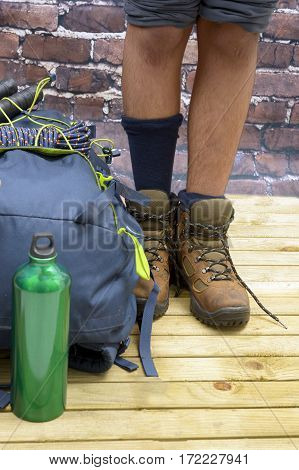 Hiking equipment rucksack boots and backpack. Concept for family hiking. Colorful background.