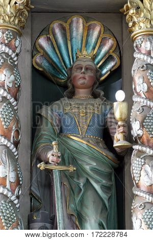KRAPINA, CROATIA - MAY 15: Saint Barbara statue at the altar in the church of Saint Catherine of Alexandria in Krapina, Croatia on May 15, 2011.