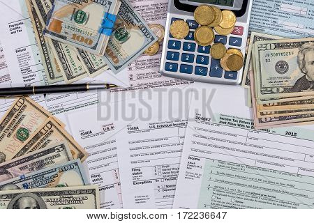 Filing Taxes Form, Money, Calculator And Pen.