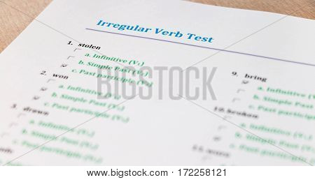 multiple choice english exam on wooden table