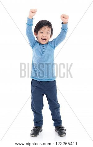 Cute Asian child showing winner sign on white background isolated