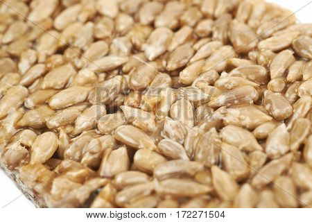 Close-up fragment of a gozinaki confection sweets as a backdrop composition with a shallow depth of field