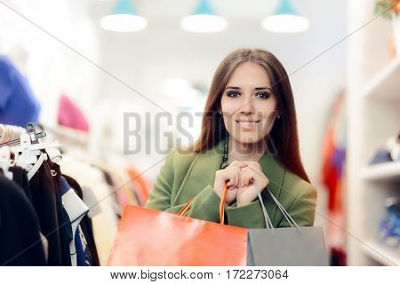 Elegant Shopping Woman Wearing a Green Coat in Fashion Store