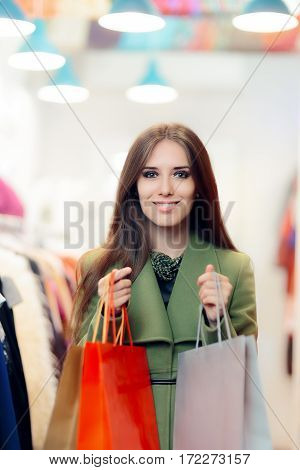 Elegant Shopping Woman Wearing a Green Coat in Fashion Store