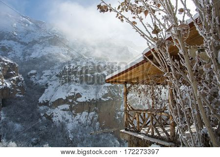 A winter panorama of Geghard Monastery unique architectural construction and a UNESCO World Heritage in Armenia. Horizontal picture.