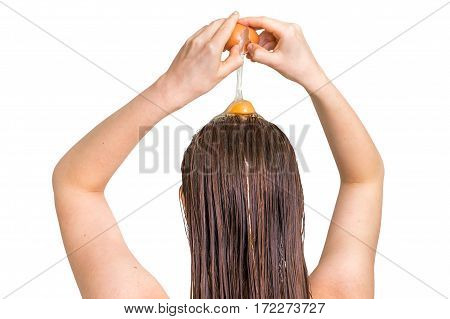 Woman Applying Egg Conditioner On Her Hair