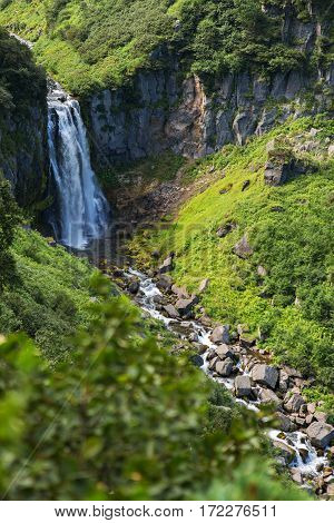 Waterfall Spokoyny in the brookvalley at the foot of outer north-eastern slope of caldera volcano Gorely.