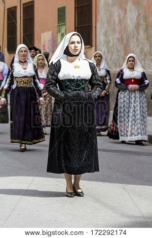 CAGLIARI, ITALY - May 1, 2014: 358 Religious Procession of Sant'Efisio - Sardinia - portrait of a beautiful woman in traditional Sardinian costume