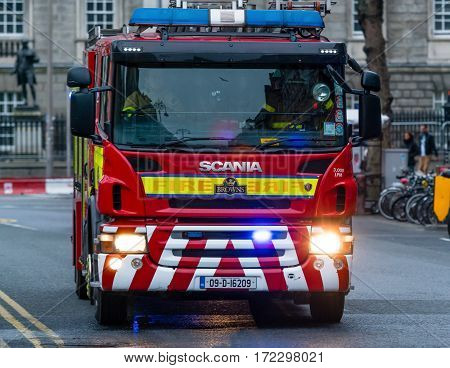 Dublin, Ireland - 19 Feb 2017: Irish firefighters in the fire brigade vehicle