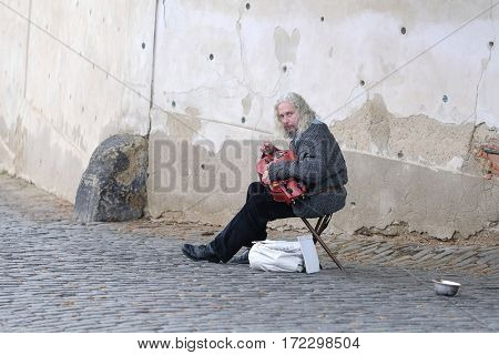 Prague, Czechia - November, 22, 2016: organ grinder in Prague, Czechia