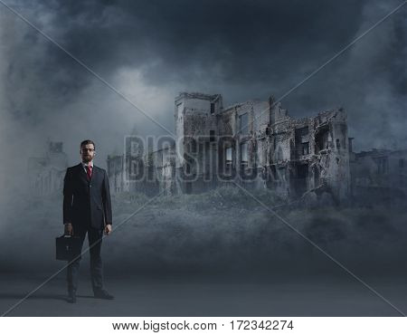 Businessman standing over apocalyptic background. Crisis, default, setback concept.