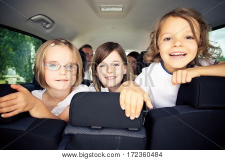 Family of five is sitting inside their car