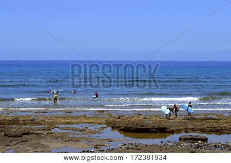 Playa De Las Americas beach Tenerife Canary Islands Spain Europe - June 12 2016 : Surfing on Playa De Las Americas beach