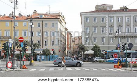 TRIESTE ITALY - OCTOBER 14: Riva Nazario Sauro Street in Trieste on OCTOBER 14 2014. Pedestrian Crossing Street in Downtown Trieste Italy.