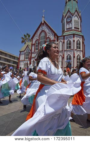 ARICA, ARICA and PARINACOTA, CHILE - FEBRUARY 10, 2017: Female dancers from the group Tumba Carnaval, performing at the annual street carnival celebrating the strength of the sun.