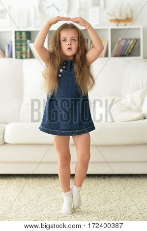 adirable little girl with beautiful long hair at home
