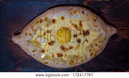 Adjaruli Khachapuri. Open pie with cheese in the shape of the boat.