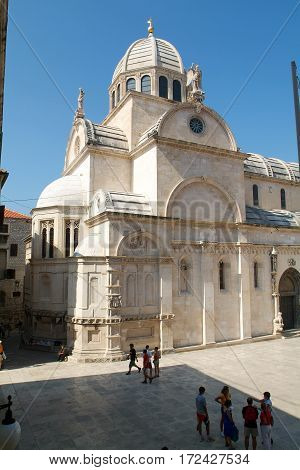 SIBENIK CROATIA - September 5 2004: Pepole walking in front of the Cathedral of St. James in Sibenik Croatia. UNESCO World Heritage Site