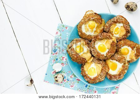 Meat bird nests with quail eggs top view