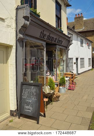 ST NEOTS, CAMBRIDGESHIRE, ENGLAND - JUNE 21, 2016: Store front of The Shop at Forty which sells Retro and Vintage wares with stock outside on the pavement.