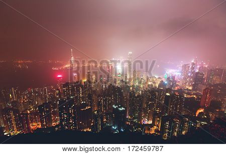 Beautiful super wide-angle summer aerial view View of Hong Kong island skyline, Victoria Bay harbor, with skyscrapers, blue sky and scenery beyond the city, seen from Kowloon island observation Deck