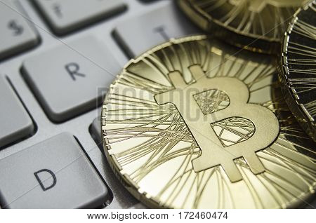 Shiny Gold Bitcoin Coin Laying On White Keyboard