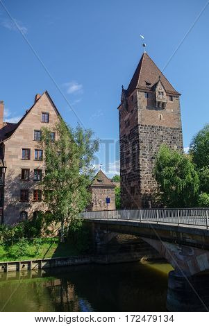 Old Tower Schuldturm And Heubrucke  Bridge Across  Pegnitz River In Nuremberg Old Town, Bavaria. Ger