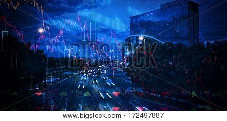 Stocks and shares against cars moving on road in city at night