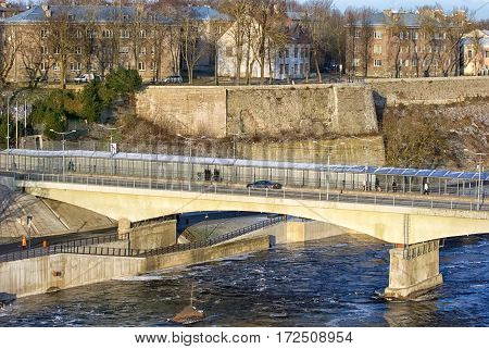 NARVA, ESTONIA - JANUARY 3, 2017: Bridge of Friendship with pedestrian tunnel over Narova River between Narva in Estonia and Ivangorod in Russia. Here is the border of two countries. View from Russia