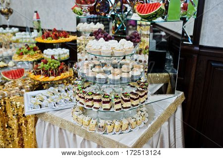 Different Swets And Cakes At Wedding Reception.