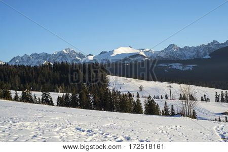 Winter mountains covered with snow view from a big meadow in Tatry mountains in Poland
