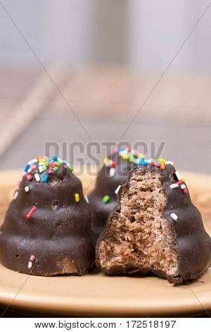 Biten Delicious Chocolate Cream Cake On The Plate