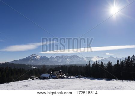 Winter mountains covered with snow view from a big meadow in Tatry mountains in Poland
