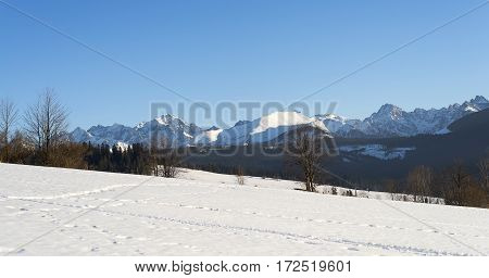 Winter mountains covered with snow view from a big meadow in Tatry mountains in Poland