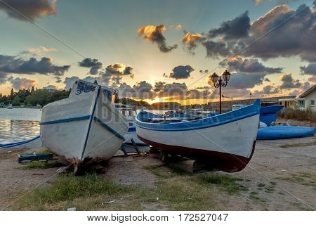 Old Boat and Amazing sunset on port of Sozopol, Burgas Region, Bulgaria