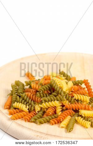 Raw Colored Macaroni On The Wooden Board With Copy Space