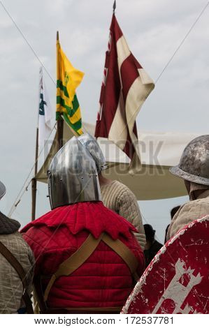 Knights with Silver Helmets and Shields seated on Chair: Medieval Event Reconstruction