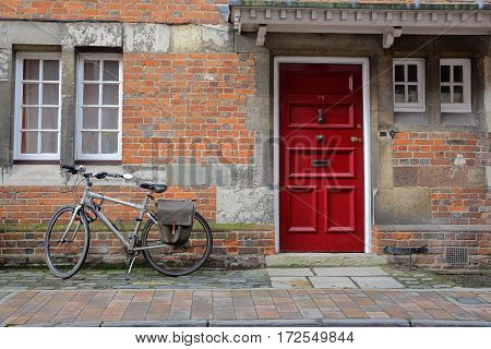 WINCHESTER, UK - FEBRUARY 4, 2017:  Exterior facade of a house on Kingsgate Street with a colorful brick wall