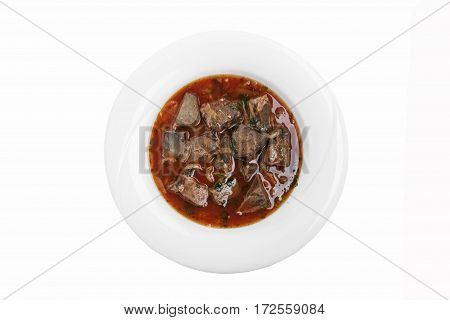 fried liver heart in tomato sauce kaurma  traditional Georgian dish white background top view