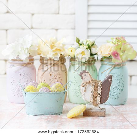 Beautiful flowers in mason jars and shabby chic decoration.