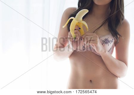 Sexy Woman In Underwear Holding Banana - Sex And Erotic Concept