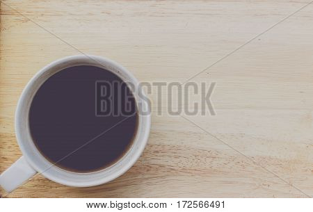 coffee bean and coffee mug on wood background