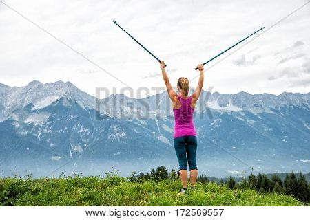 Young woman without backpack hiking in the mountains Alps. Austria. Insbruk
